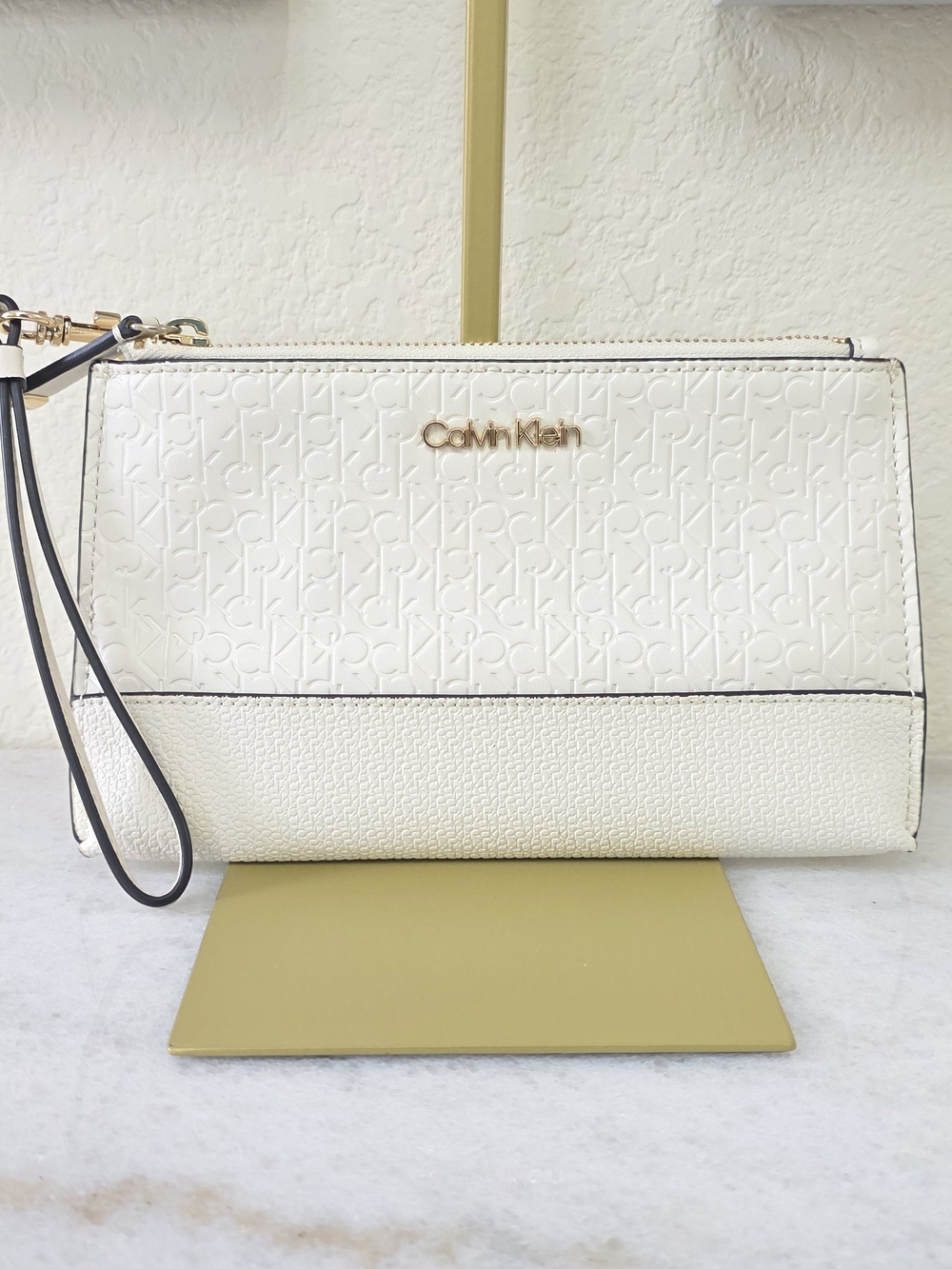 Calvin Klein Cream Embossed Logo Wristlet Clutch with Gold Hardware